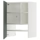 Open white cabinet with grey-green door, metal hinges, adjustable shelves.