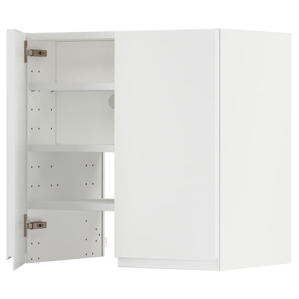A white METOD kitchen cabinet with a modern design, featuring adjustable shelves and minimalist handles.
