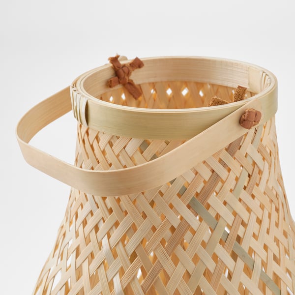 Woven bamboo lamp with minimalist design, featuring natural light and eco-friendly craftsmanship.