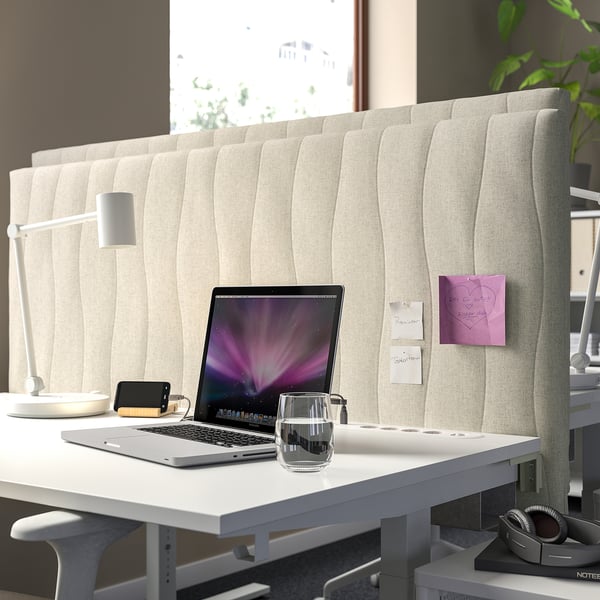 MITTZON screen, laptop, lamp on desk. Cream, textured, with notes. Modern.