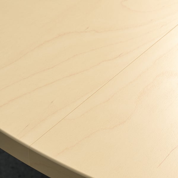 Clean, polished light wood tabletop, showing smooth, even finish, reflecting light softly.