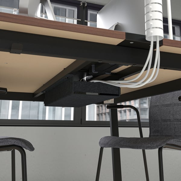 Under-table cable management system, keeping workspace organised and safe.