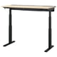 Black adjustable desk with light wood top and dual-motor lift system.