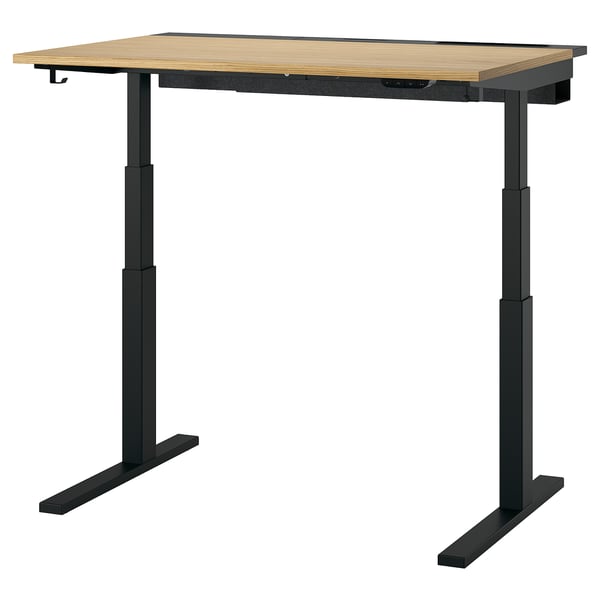 MITTZON sit-stand desk in black and light wood, modern design with adjustable height, two legs, central support, and electric lift mechanism.