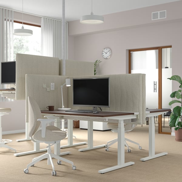 Modern office with MITTZON desks- adjustable, sturdy white desks with high-tech spacious, well-lit room.