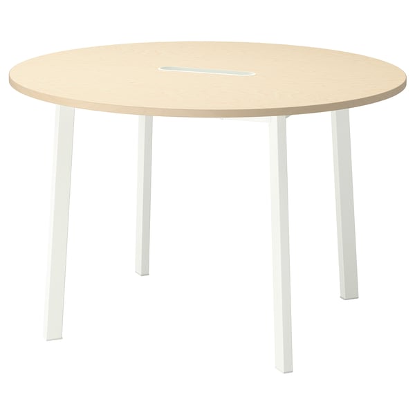 A round, light-colored MITTZON office table with four white legs and a stain-resistant surface.