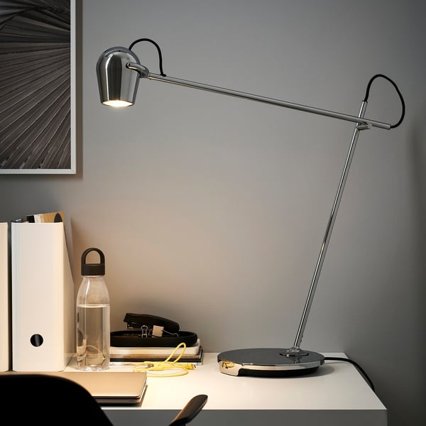 Modern chrome desk lamp MODERMOLN, adjustable, illuminating workspace with sleek design.