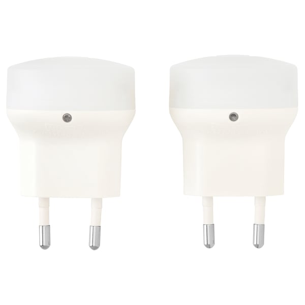Two white, compact, plastic nightlights with automatic sensors.