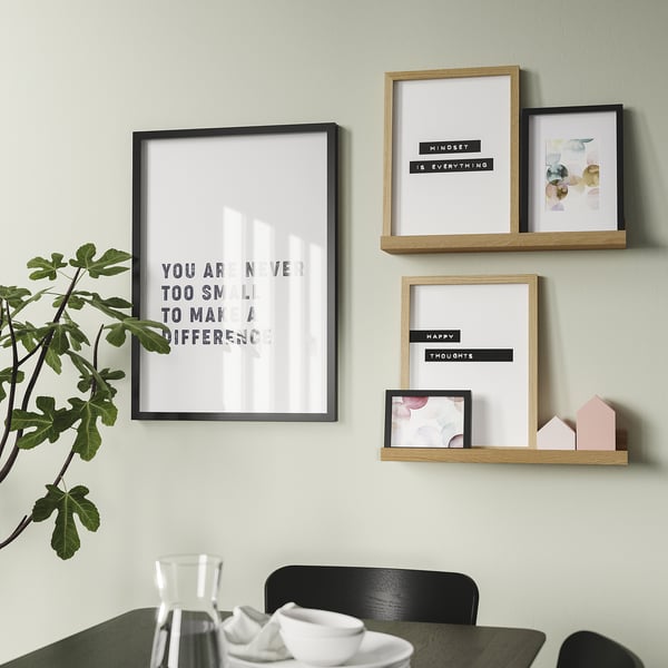 Modern wall shelf displays pictures and decor. A groove for angle support. Holds frames and small items securely.