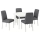 Modern round white dining table with four grey upholstered chairs.