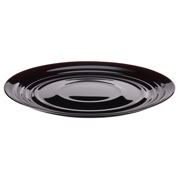 Round, black glossy plate. Made of tempered glass with a ripple design.