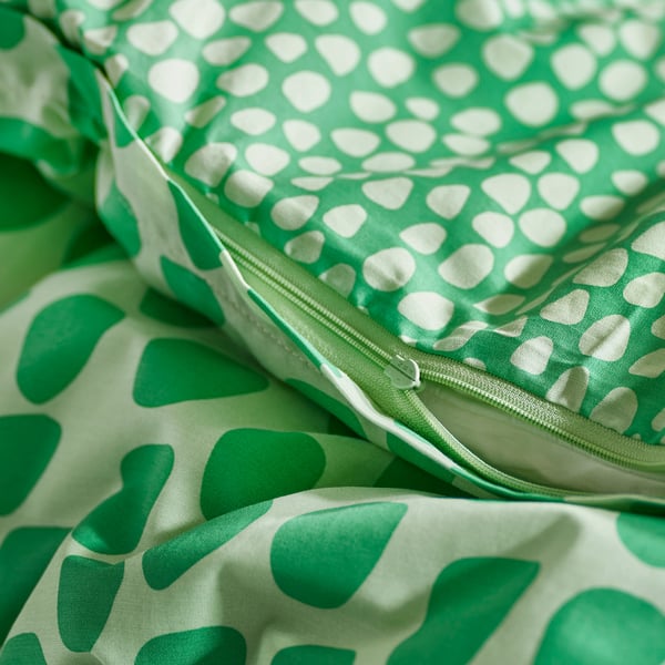 Green duvet cover with zip, crocodile-themed pattern.