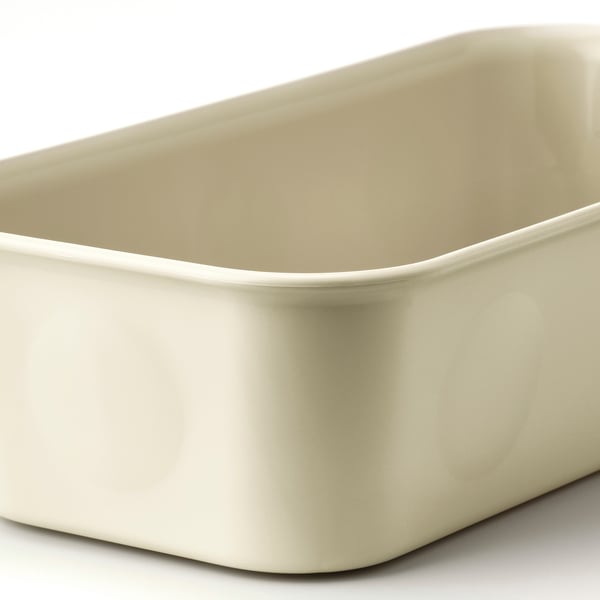 Smooth, cream-colored plastic container, rectangular with slightly rounded edges, designed for organising small items.