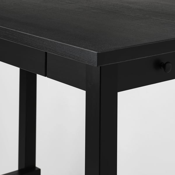Black bar table with sleek, dark wood finish and drawer. Modern design, sturdy legs.