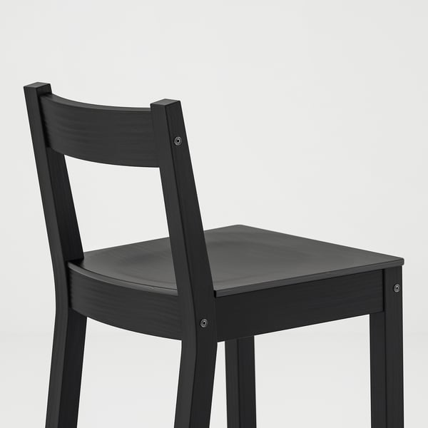 Black wooden chair with sleek backrest and seat, showing quality craftsmanship and sturdy design.