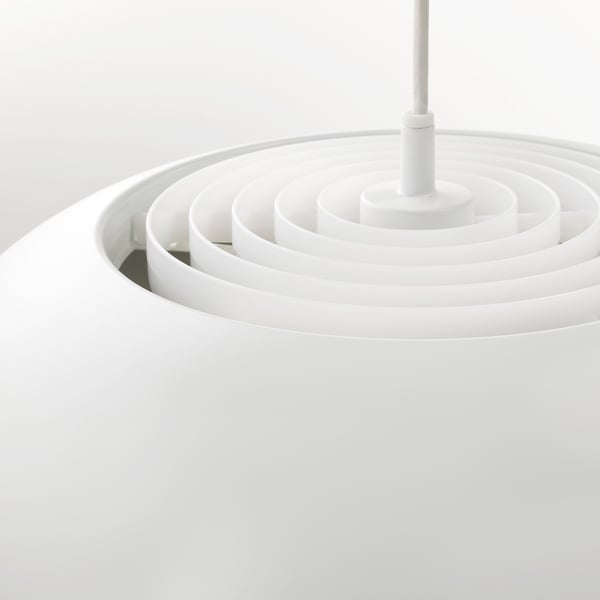 Modern white pendant light with concentric circles, emitting soft, glare-free illumination.