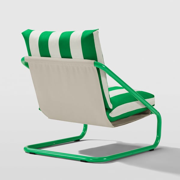 Bright green metal armchair with white-green striped cushions, designed for comfort and outdoor use.