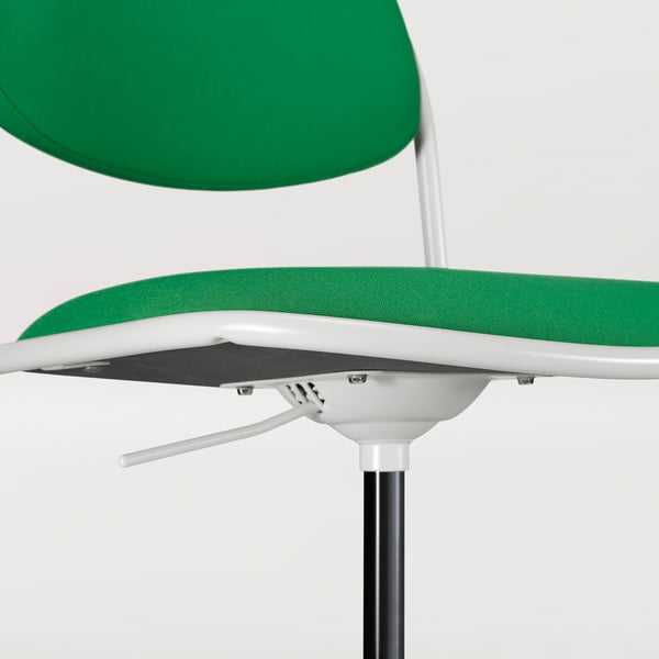 Modern office chair detail - green fabric, white frame, adjustable base.