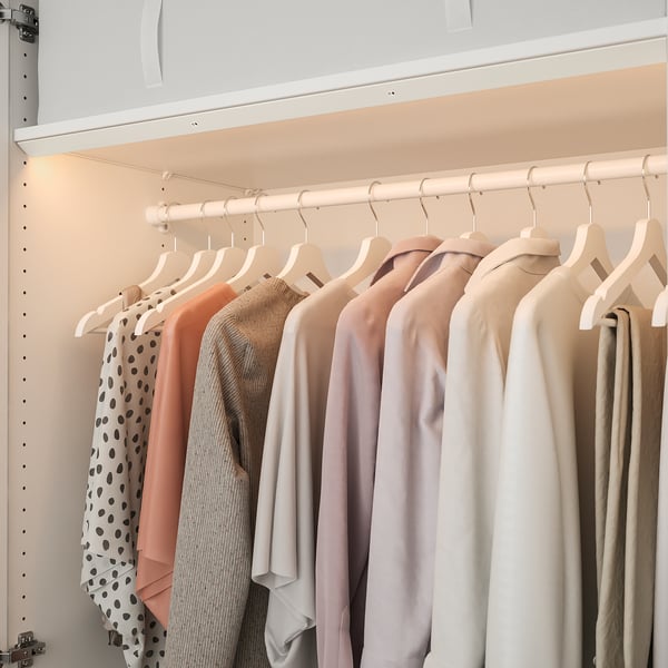Wardrobe with led lights highlighting clothes.