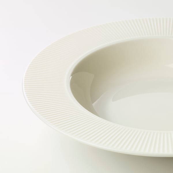 Smooth, white, porcelain dish with ridged edges. Elegant, simple design.