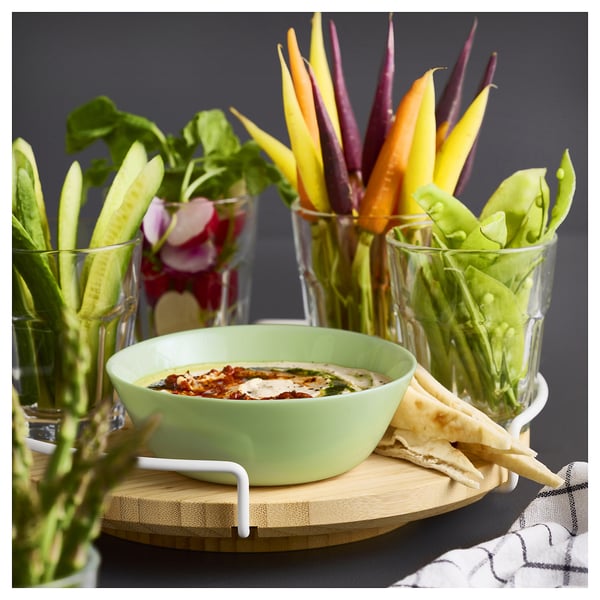 Green glass bowl with veggies & pita.