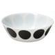 Black and white ceramic bowl with large circular dots on the exterior.