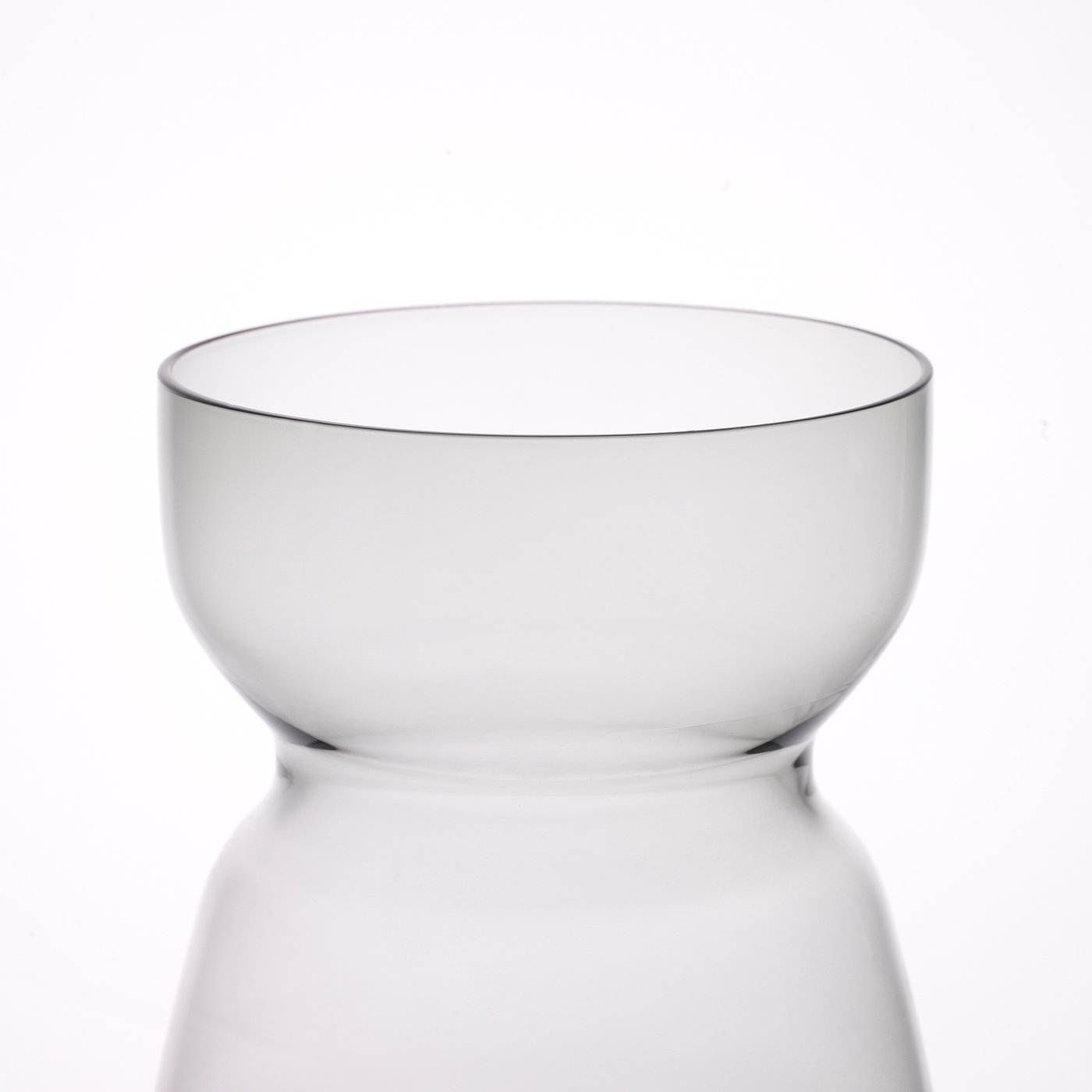 Clear glass vase with smooth, round shape; mouth-blown, quality craftsmanship.
