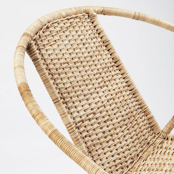 Close-up of woven rattan chair, showcasing intricate weave and natural texture.