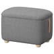 This image shows a grey OSKARSHAMN footstool with a leather handle, wooden legs, and rounded design.