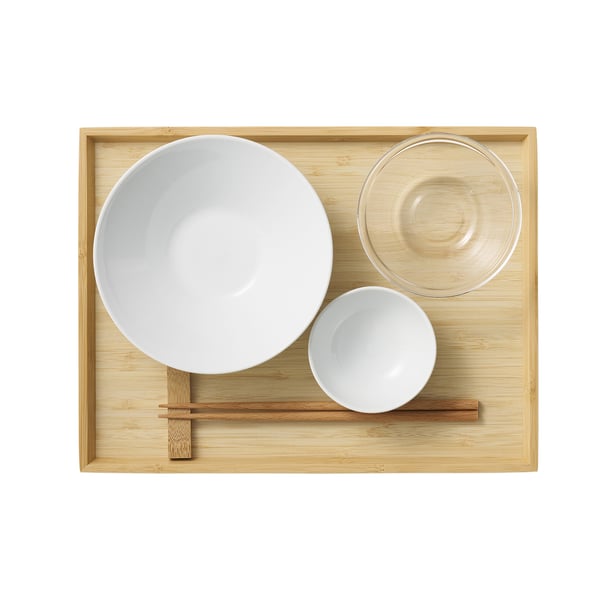 A bamboo tray with white bowls and chopsticks. Ideal for food and beverage service.
