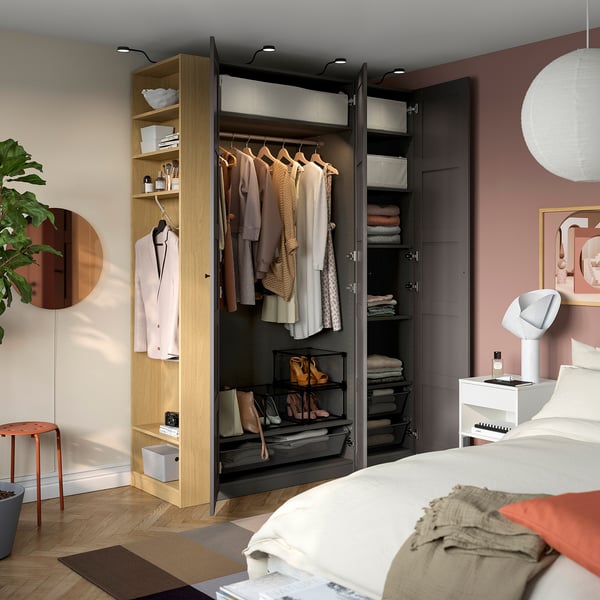 Organised wardrobe with hanging rail, shelves, shoe storage, and integrated lighting.