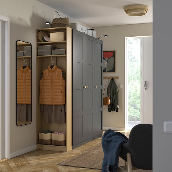 Modern grey wardrobe with hangers, drawers, shelves, mirror, coat rack, efficient storage.