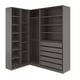A gray corner wardrobe unit, PAX, with multiple shelves and drawers for storage.