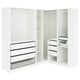 A white corner PAX wardrobe with adjustable shelves and drawers, featuring a mesh basket and a trouser hanger.