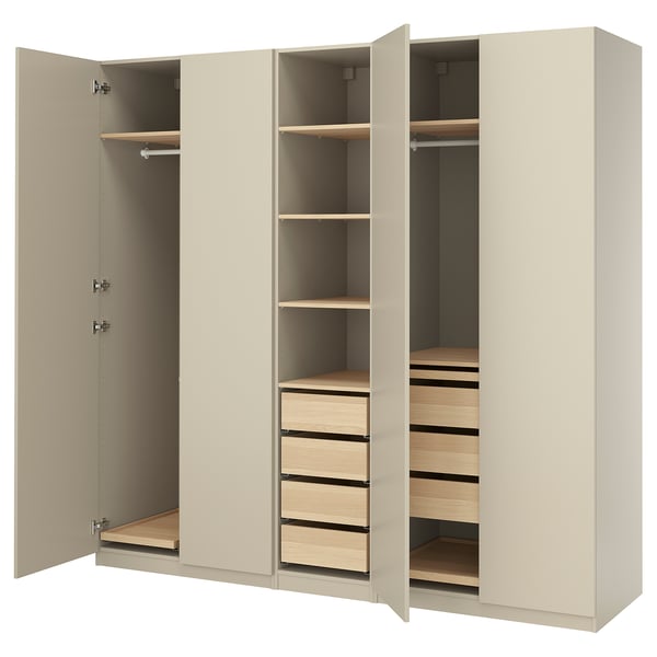 An open beige PAX wardrobe with shelves, drawers, and a hanging rod, featuring modern design and practical storage solutions.
