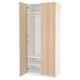 An open light-wood ikea PAX wardrobe with adjustable shelves.
