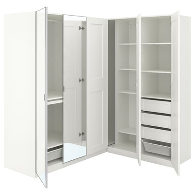 A white PAX corner wardrobe with mirrored doors and internal shelves.