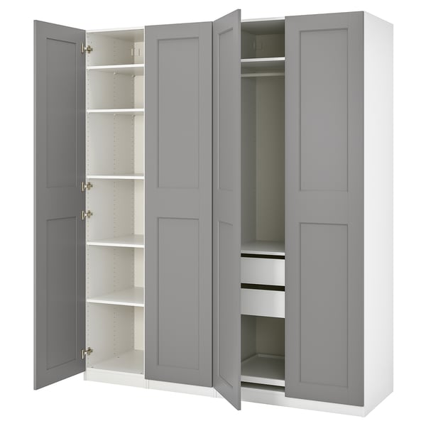 A grey ikea PAX wardrobe with open doors, revealing shelves and drawers inside.