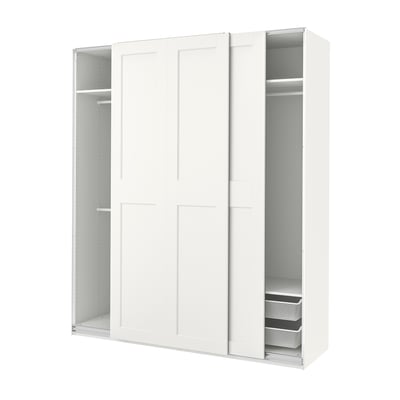 A white PAX wardrobe with sliding doors, showcasing storage shelves and mesh baskets.