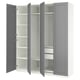 An open gray ikea PAX wardrobe with multiple shelves and compartments. It has a sleek, rectangular design and a modern, minimalist aesthetic.