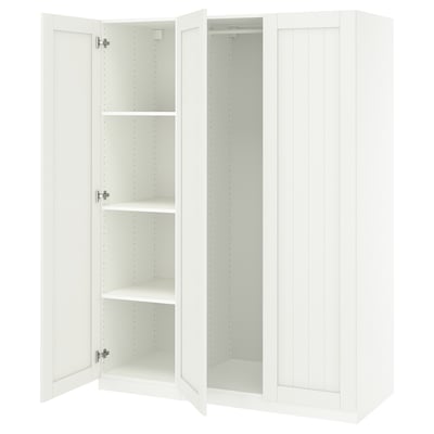 A white ikea PAX wardrobe with open doors, revealing empty shelves inside.
