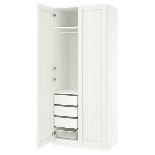 A white ikea PAX wardrobe with two doors open, revealing shelves and drawers.