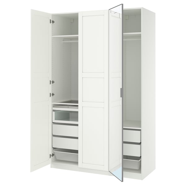 White PAX wardrobe with mirrored doors and organized drawers.