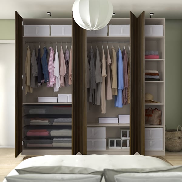 Walk-in closet with organised clothes and shelves.