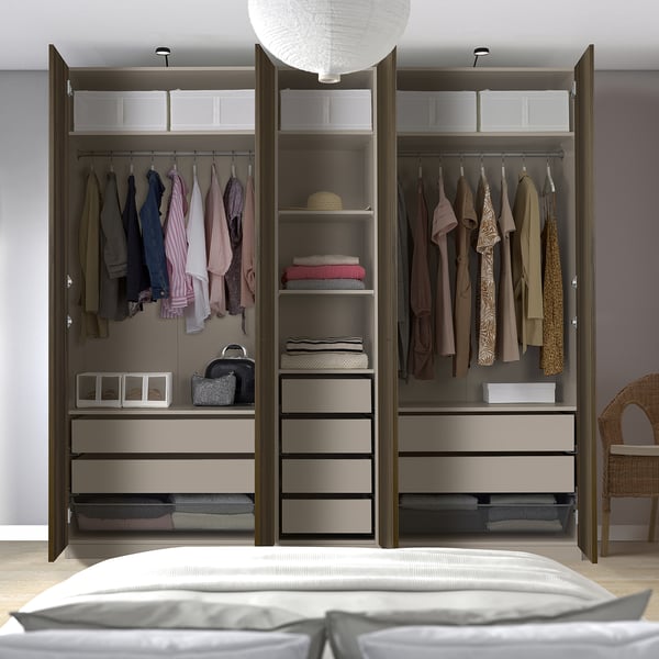 Modern wardrobe with organised clothes, shelves, storage bins, and mesh drawers.
