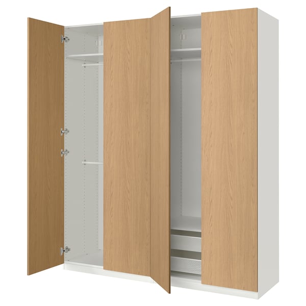 A light-colored wooden wardrobe with open doors showing shelves and a hanging rod inside.
