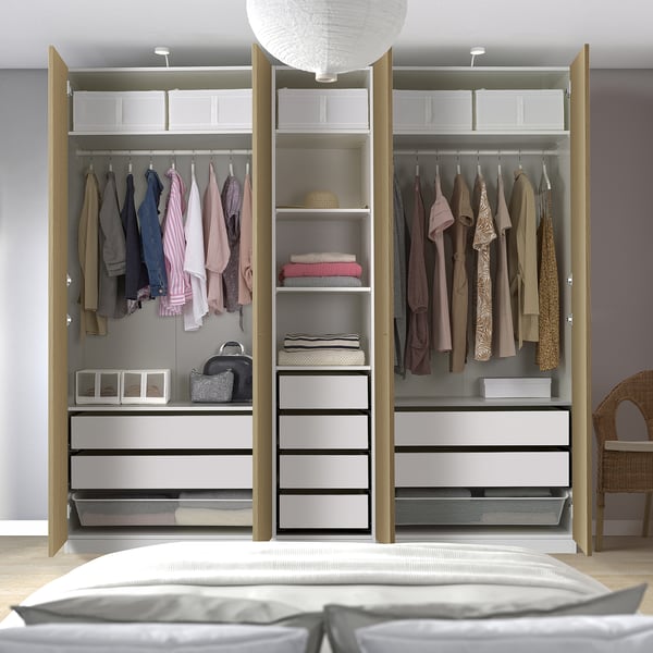Open wardrobe with clothes, shelves, and drawers for organised storage. Adjustable feet and integrated lighting options.