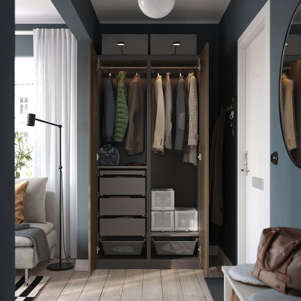 Modern open wardrobe hanging clothes, shelves, and drawers. Integrated lighting and spacious design maximise organisation.