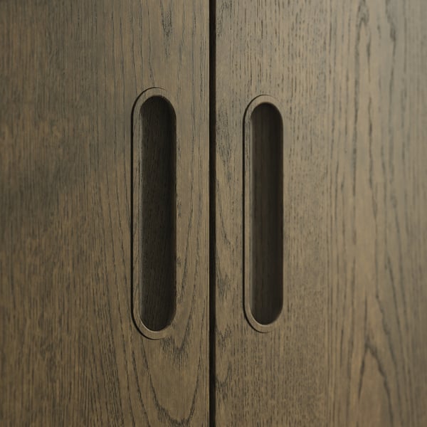 A pair of modern wooden cabinet doors with oval cutouts.
