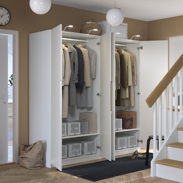 Well-organized closet with clothes and storage boxes. Include soft-closing doors and adjustable shelves.